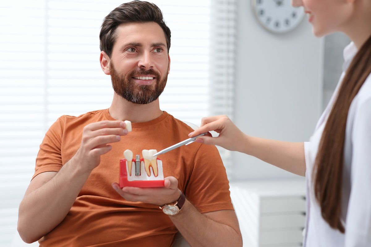 Man learning about dental implants